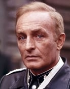 Anton Diffring (Col. Kramer)