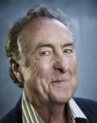 Eric Idle (Mr. Cheeky / Stan 'Loretta' / Harry the Haggler / Culprit Woman / Warris / Intensely Dull Youth / Jailer's Assistant / Otto / Lead Singer Crucifee)