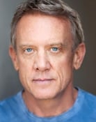 Simon Burke (Greg Owens)